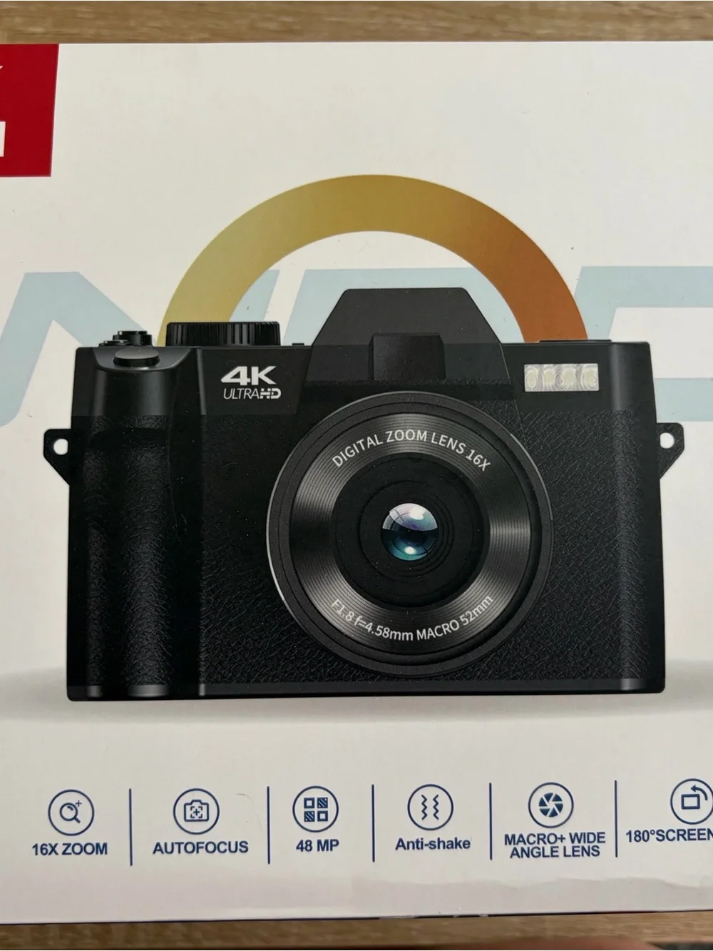 Compact White and Black Digital Camera with Zoom Lens